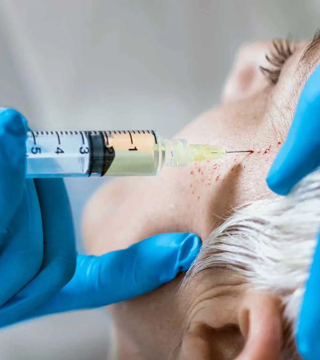 Clinic doctor doing mesotherapy on a patient